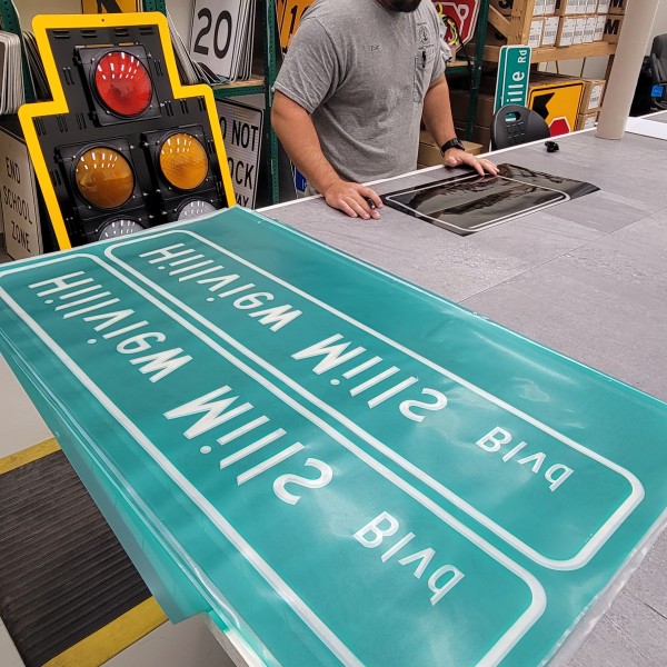 Signal Technician II Eric Joiner making signs for the Hillview Mills Subdivision (29 October)